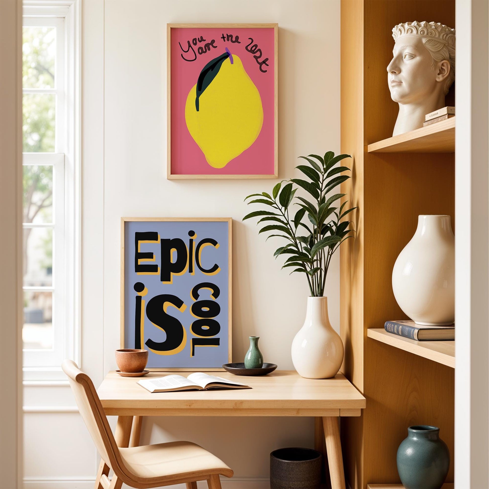 &quot;Epic is Cool&quot; poster in a playful, hand-drawn black and yellow font on a pastel blue background, inspired by retro pop art style.
