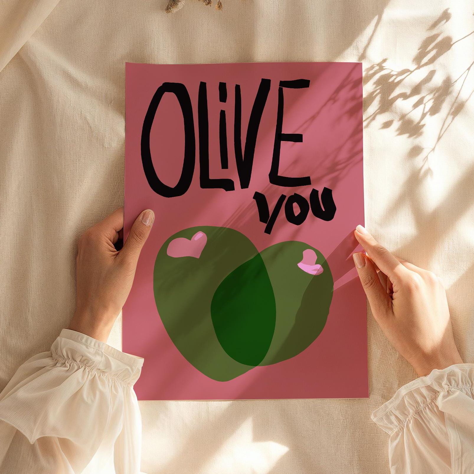 This digital poster features the playful phrase &quot;OLIVE you&quot; in bold, black, hand-drawn lettering on a pink background. Two green olives with pink hearts add a cute and charming touch, making it a perfect humorous gift or wall decor for lovers.